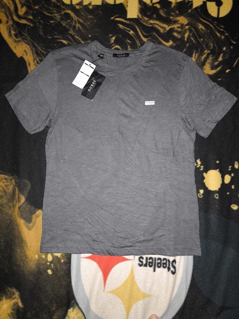 Grey Guess Los Angeles Tee (Category: Tshirts & Polo Shirts ) located in Manila. Submitted by fljaoti27 (Listing ID 1463956954, Image 1). Description: Guess Tee Medium.