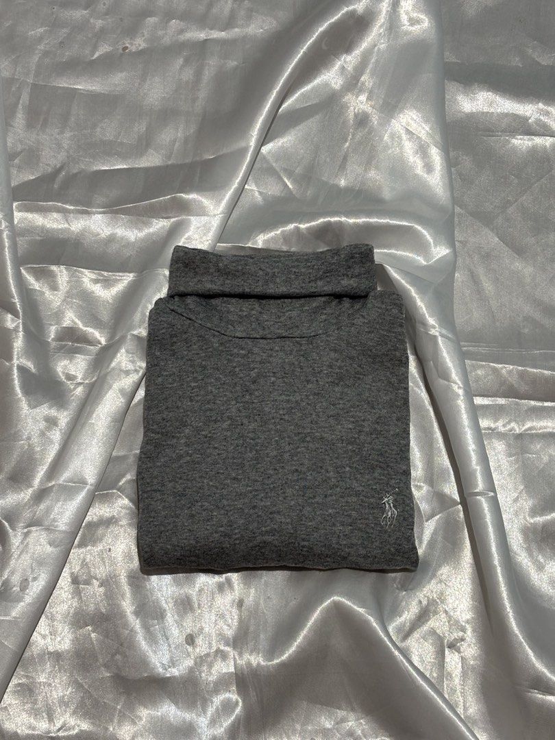 Grey Polo Ralph Lauren Turtleneck Sweater (Category: Longsleeves) located in Manila. Submitted by k1win4wi (Listing ID 1464069169, Image 1). Description: - Polo Ralph Lauren grey turtleneck sweater - Soft material, ideal for layering - Signature pony logo embroidered on chest - Classic fit for comfortable everyday wear - Versatile: pairs well with jeans or trousers.