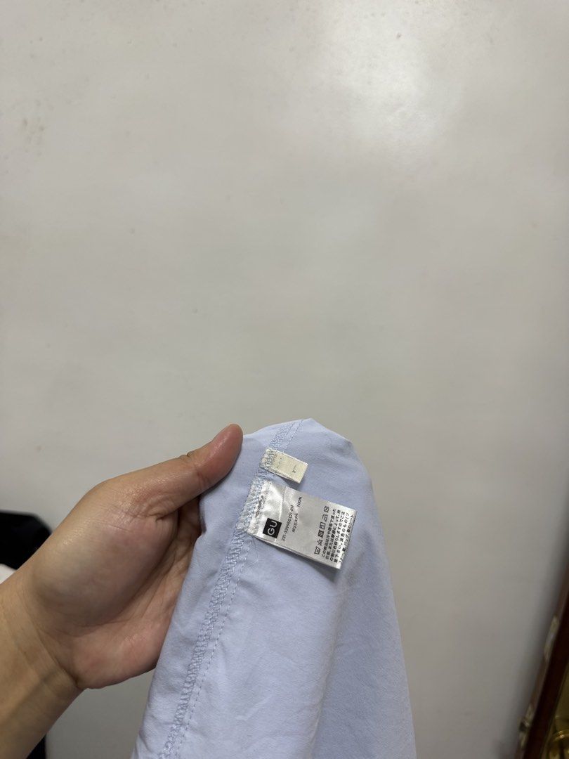 GU Light Blue Long Sleeve Button Up Shirt (Category: Longsleeves) located in Cavite. Submitted by yakultjeni85475 (Listing ID 1464104701, Image 3). Description: - Light blue long sleeve shirt - Brand: GU - Classic button-up style - Features a chest pocket - Relaxed fit - Versatile for casual and smart-casual wear - Easy to pair with various outfits.