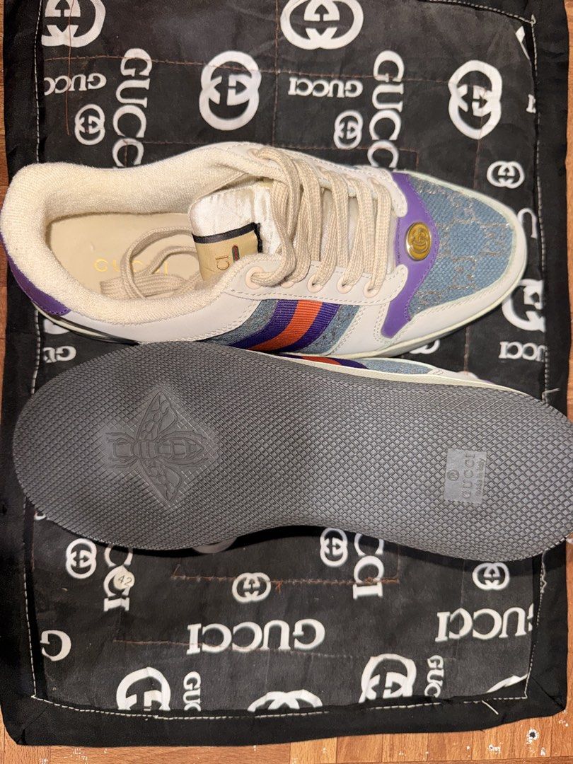Gucci Ace Sneaker Denim GG Supreme (Category: Sneakers) located in Manila. Submitted by adornadoje25733 (Listing ID 1463960960, Image 1). Description: - Authentic Gucci Ace sneakers - Denim and leather construction - Iconic GG Supreme canvas - Signature green and red stripe detail - Purple heel with embossed Gucci logo - Lace-up closure - Includes original dust bag.