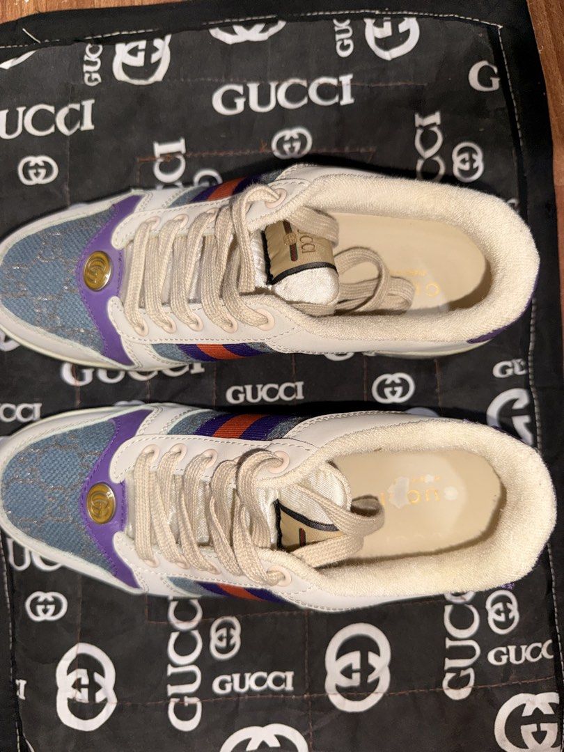 Gucci Ace Sneaker Denim GG Supreme (Category: Sneakers) located in Manila. Submitted by adornadoje25733 (Listing ID 1463960960, Image 3). Description: - Authentic Gucci Ace sneakers - Denim and leather construction - Iconic GG Supreme canvas - Signature green and red stripe detail - Purple heel with embossed Gucci logo - Lace-up closure - Includes original dust bag.