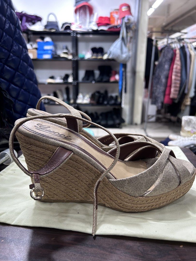 Gucci Espadrille Wedge Sandals (Category: Wedges) located in Pasig City. Submitted by blitzkriegspc (Listing ID 1464136805, Image 2). Description: - Authentic Gucci espadrille wedges - Crafted with durable canvas and leather straps - Chic rope wedge heel for added height - Secure ankle strap with buckle closure - Versatile style perfect for any occasion - Note: Shows some signs of wear on the insole.
