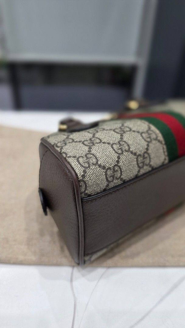 Gucci Ophidia GG Mini Duffle Bag (Category: Luxury Bags & Wallets) located in San Fernando. Submitted by bagproject (Listing ID 1464060907, Image 3). Description: - Authentic Gucci mini duffle bag - Classic GG monogram canvas - Signature green and red stripe detail - Brown leather trim and handles - Detachable shoulder strap included - Gold hardware - Ideal for everyday use or a night out.