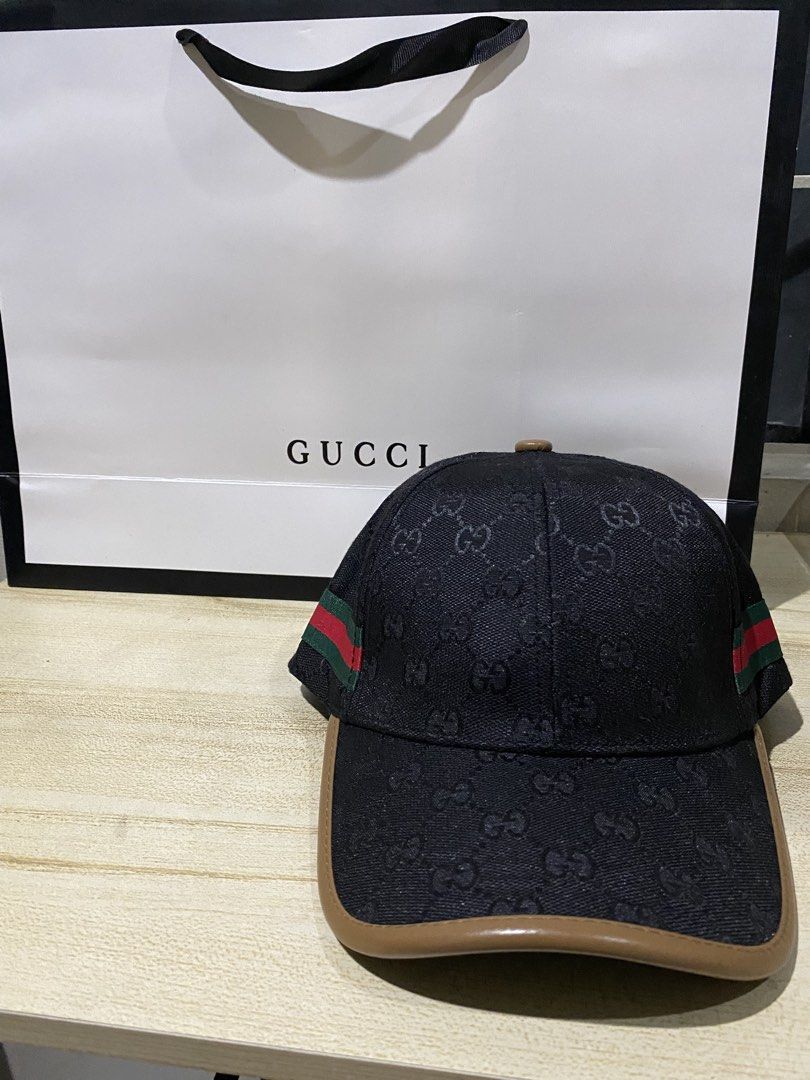 Gucci Original GG Canvas Baseball Cap (Category: Caps & Hats) located in Quezon City. Submitted by carlos132 (Listing ID 1464123161, Image 1). Description: - Iconic Gucci cap with GG monogram pattern - Features classic green and red stripe detail - Made in Italy - Genuine leather trim - Adjustable strap for a comfortable fit - Comes with original Gucci dust bag - Perfect accessory to elevate any look.