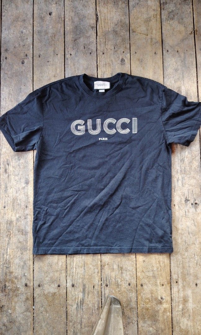 Gucci spellout (Category: Tshirts & Polo Shirts ) located in Cagayan de Oro. Submitted by johnzj002 (Listing ID 1463960224, Image 1). Description: Size xl on tag No issue Colorate 10/10 Excellent condition.