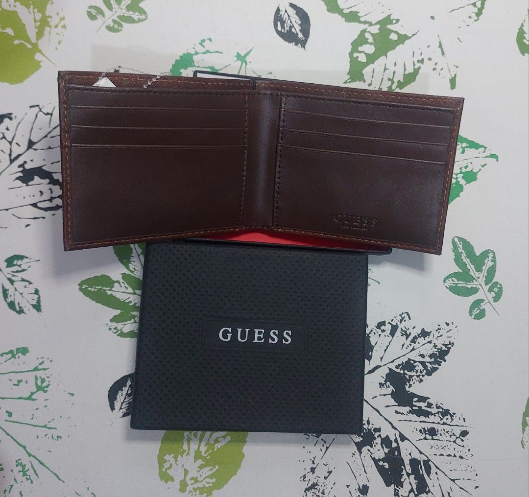 Guess Brown Leather Bifold Wallet with Box (Category: Wallets & Card holders) located in Cainta. Submitted by cooletzky (Listing ID 1463945545, Image 1). Description: - Guess brown leather bifold wallet - Ample card slots for all your essentials - Comes with original Guess box - Features embossed Guess logo on the exterior - Ideal for everyday use.