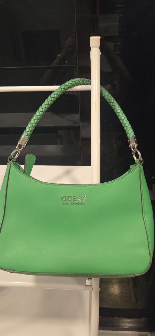 Guess Green Shoulder Bag with Braided Strap (Category: Shoulder Bags) located in Makati City. Submitted by jheng0429 (Listing ID 1463996807, Image 1). Description: - Cute green Guess shoulder bag - Braided strap with silver hardware - Guess logo embossed on the front - Adds a pop of color to any outfit - Perfect size for essentials.