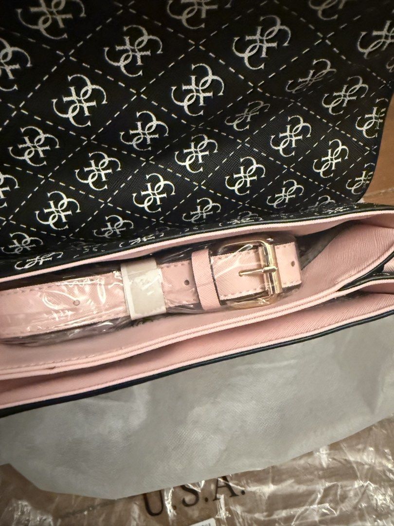 Guess Monogram Clutch Bag with Pink Stripes (Category: Shoulder Bags) located in Bulacan. Submitted by emjay_17 (Listing ID 1464053328, Image 3). Description: - Features a stylish pink stripe detail on the front flap. - Interior lined with a chic light pink fabric. - Comes with a convenient detachable pink strap. - dust bag included for safekeeping. - Ideal accessory for evenings out or special events..