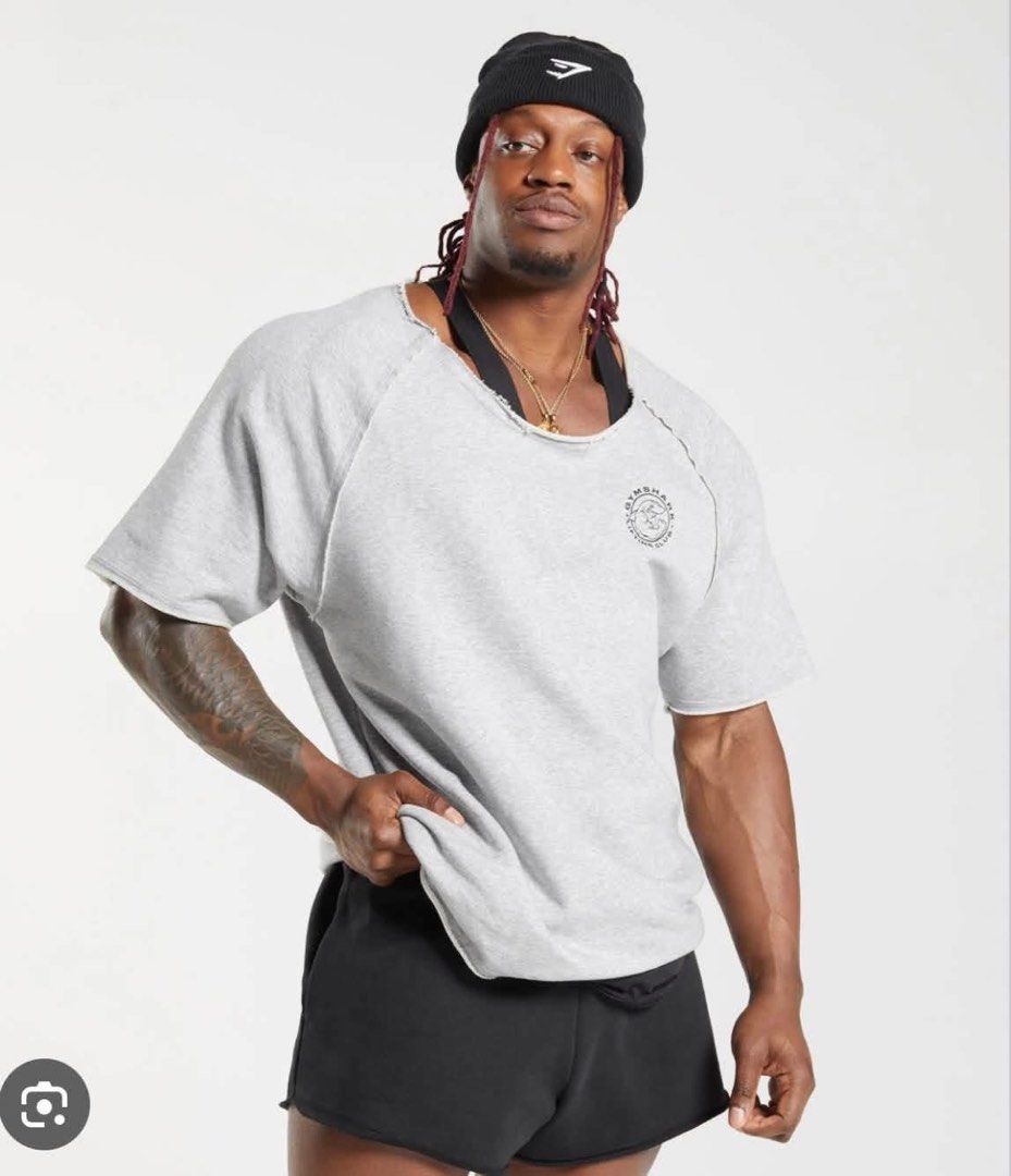 Gymshark Oversized Raglan T-Shirt Size L (Category: Activewear) located in Sinait. Submitted by rinzuthrift (Listing ID 1464005249, Image 2). Description: - Gymshark oversized raglan t-shirt - Color: Light beige - Size: L - Distressed raw hem and neckline for a vintage look - Short sleeves - Ideal for workouts or everyday casual wear.