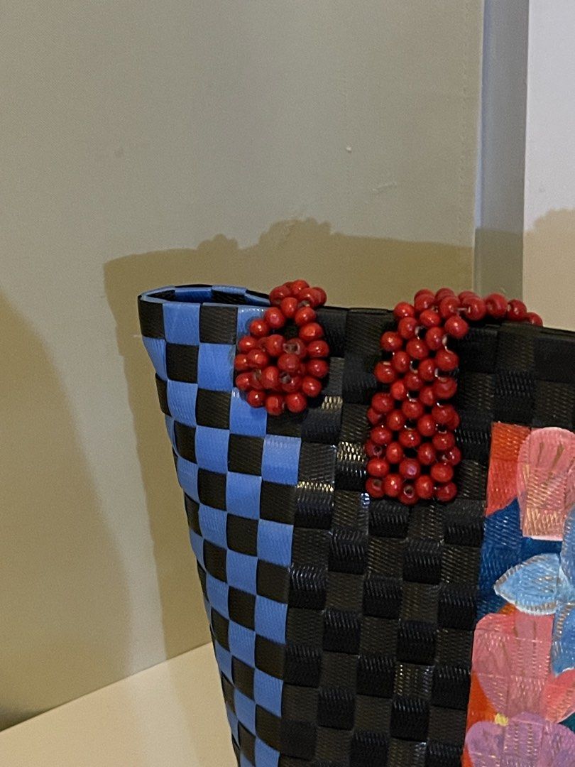 Hand crafted bayong bag (Category: Shoulder Bags) located in Muntinlupa City. Submitted by declutter.clubph (Listing ID 1464068415, Image 3). Description: body material: durable recycled plastic closure: beaded loop closure handles: multi-strand hand beaded shoulder strap details: hand-painted line art. .