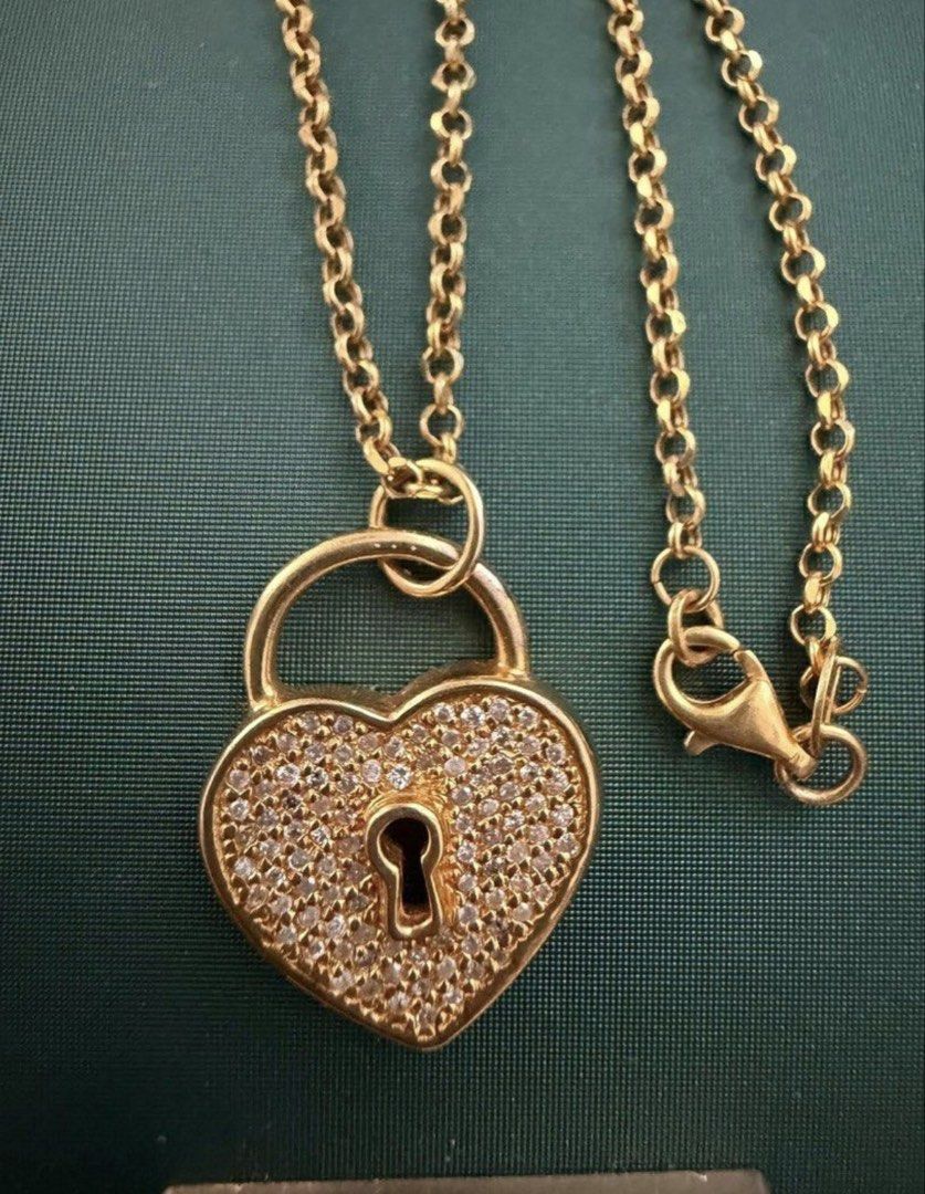 Heart Diamond Padlock Pendant (Category: Necklaces) located in San Pedro. Submitted by loveeofgoldiss (Listing ID 1463963686, Image 2). Description: Pendant Only Chain not included 14karat White gold sia pinatubog lang sa gold Natural Dia Per piece hindi per gram ang benta.