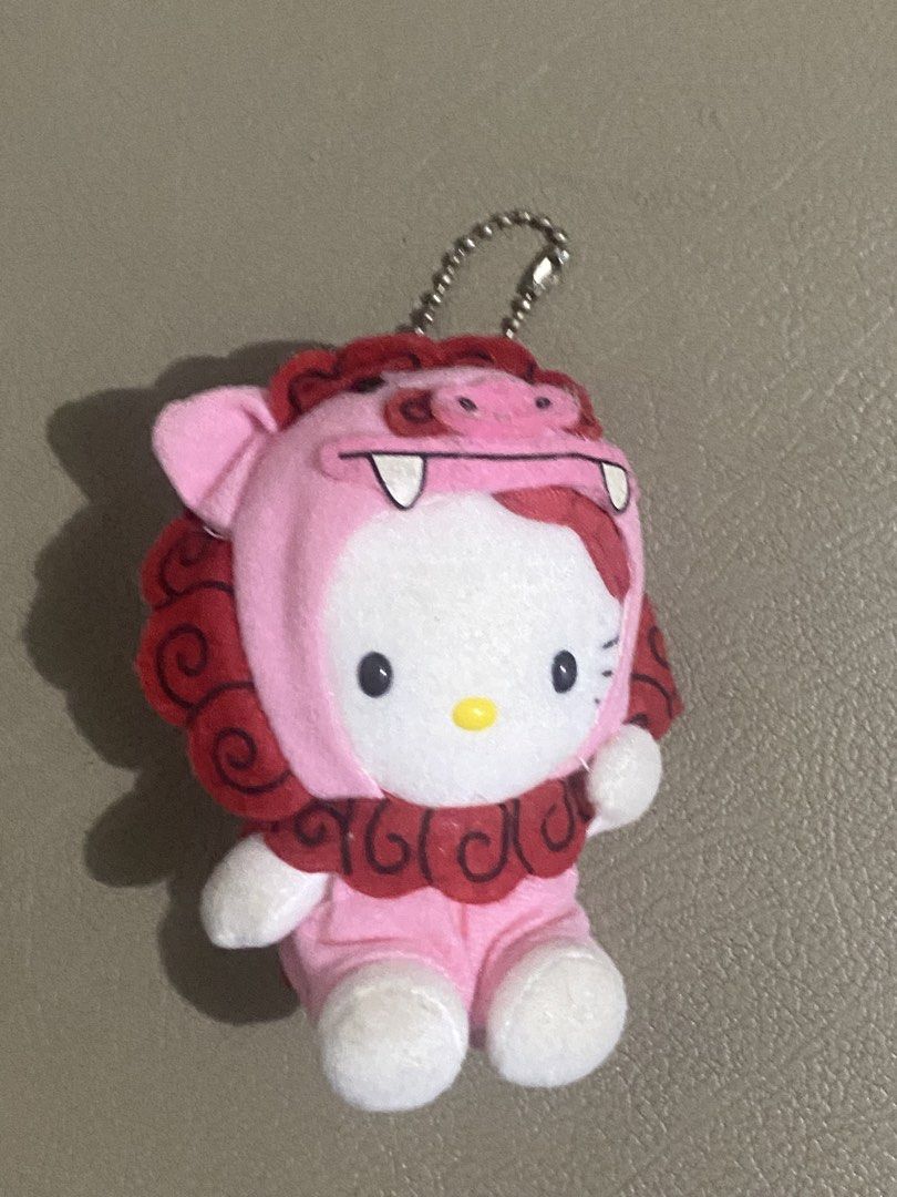 Hello Kitty Lion Dance Plush Keychain (Category: Plushies & Soft Toys) located in Davao. Submitted by hoowans_surplus (Listing ID 1464067690, Image 1). Description: - Adorable Kitty plush keychain. - Features a charming pink lion dance costume. - Comes with a sturdy metal keychain ring. - Ideal accessory for your bags, backpacks, or keys. - Authentic Sanrio product..