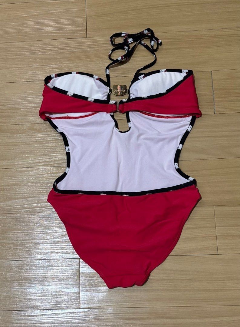 Hello Kitty Red One-Piece Swimsuit Small (Category: Bikinis & Swimsuits) located in Quezon City. Submitted by garagesale2026 (Listing ID 1464117540, Image 2). Description: - Unused, no more tag - Original from Singapore - Halter neck with Hello Kitty face detailing - With a metal Hello Kitty face on the front - Cut-out design on the sides - White lining - Padded.