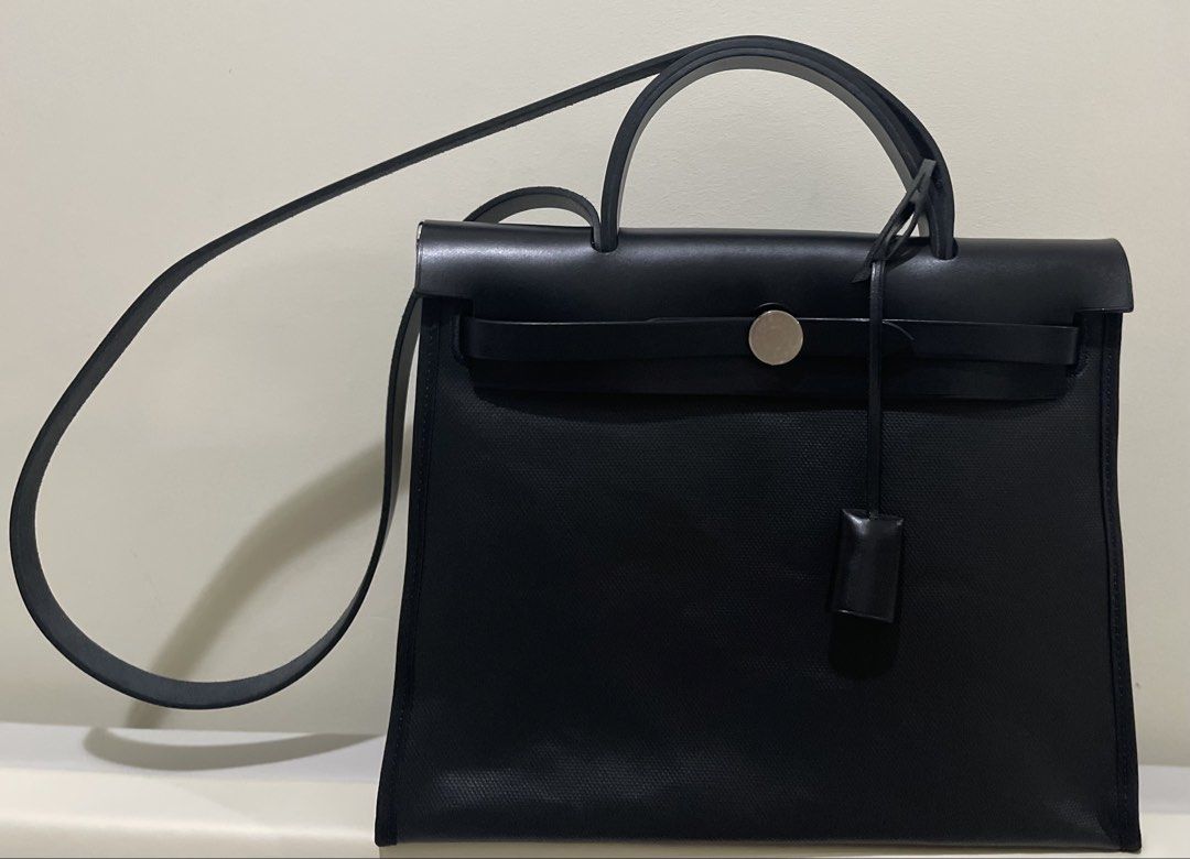 Hermes Herbag 35 (Category: Luxury Bags & Wallets) located in Quezon City. Submitted by declutteringbabyandmomstuff (Listing ID 1464086216, Image 1). Description: - Stamp Z Used 3 times Waterproof canvas Palladium hardware Noir/Noir Comes Complete: paperbag, ribborn, care card, receipt, dustbags Minor hairline scratch.