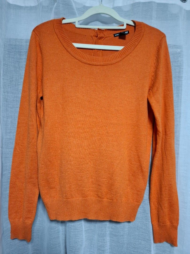 H&M Basic Orange Knit Sweater Size S (Category: Longsleeves) located in Manila. Submitted by jazil.ladyliz (Listing ID 1464074272, Image 1). Description: - H&M Basic orange knit sweater - Long sleeves and round neckline - Small button detail at the collar - Material: Acrylic, Polyamide, Alpaca blend - Comfortable and warm for cooler weather - Ideal for layering.