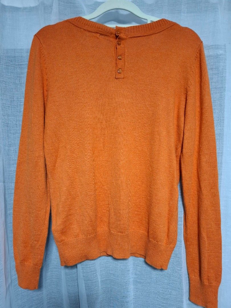 H&M Basic Orange Knit Sweater Size S (Category: Longsleeves) located in Manila. Submitted by jazil.ladyliz (Listing ID 1464074272, Image 2). Description: - H&M Basic orange knit sweater - Long sleeves and round neckline - Small button detail at the collar - Material: Acrylic, Polyamide, Alpaca blend - Comfortable and warm for cooler weather - Ideal for layering.