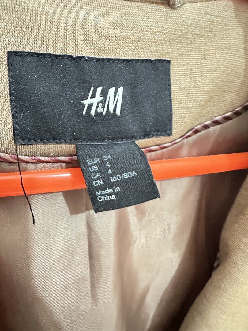 H&M Beige Single Button Blazer (Category: Coats, Jackets and Outerwear) located in General Trias. Submitted by keiperry_ (Listing ID 1463947261, Image 3). Description: - Classic beige blazer from H&M - Single button closure - Two flap pockets - Fully lined interior - Versatile for work or smart casual looks - Pairs well with trousers or skirts -Best fit for S-M.