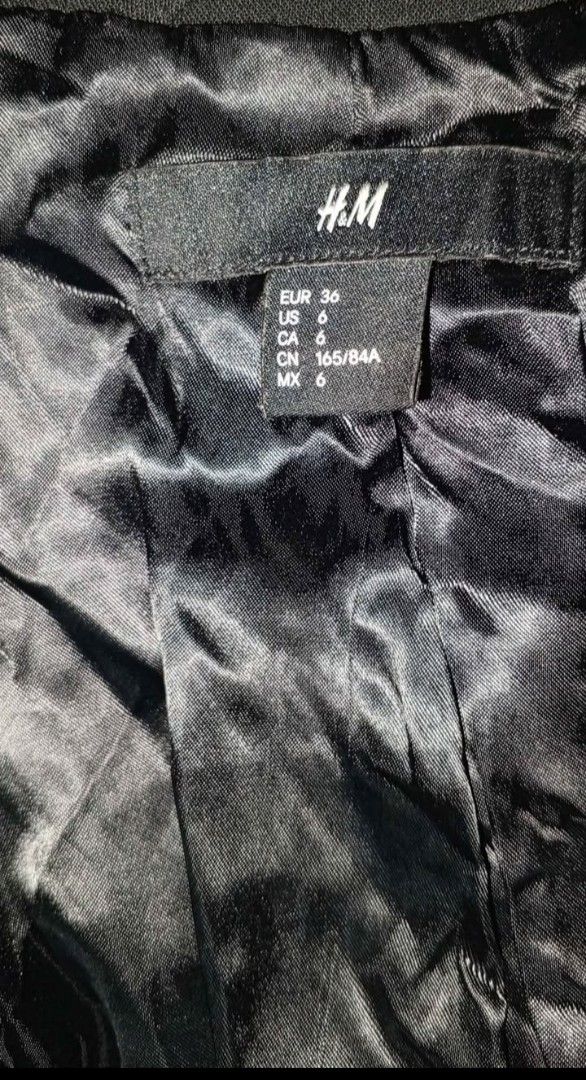 H&M Black Blazer (Category: Coats, Jackets and Outerwear) located in Quezon City. Submitted by jeyem. (Listing ID 1463969571, Image 2). Description: - Classic black H&M blazer - Single button closure for a sleek look - Features a shiny black satin lining - Elegant pocket details with satin trim - Versatile piece: dress it up or down!.
