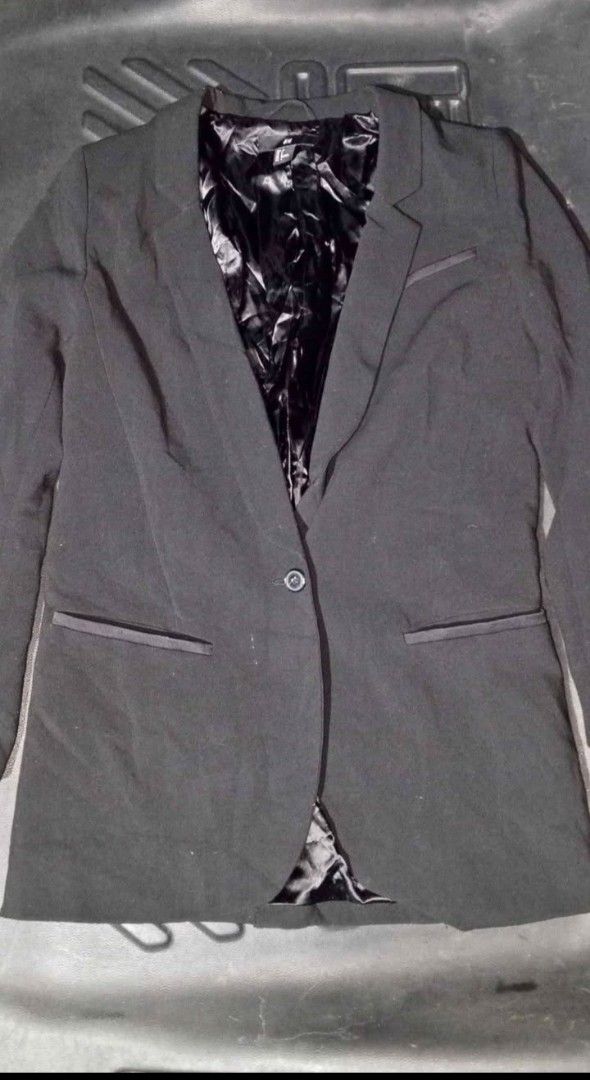 H&M Black Blazer (Category: Coats, Jackets and Outerwear) located in Quezon City. Submitted by jeyem. (Listing ID 1463969571, Image 1). Description: - Classic black H&M blazer - Single button closure for a sleek look - Features a shiny black satin lining - Elegant pocket details with satin trim - Versatile piece: dress it up or down!.