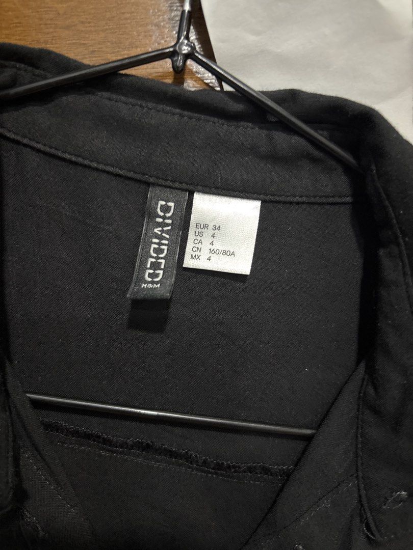 H&M Divided Black Long Sleeve Button Up Shirt (Category: Longsleeves) located in Mandaluyong City. Submitted by clothescarousel (Listing ID 1464053364, Image 2). Description: - Classic black long sleeve shirt - Brand: H&M Divided - Features: Button-up front, collar - Style: Simple, versatile, great for layering or wearing alone - Occasion: Easy to dress up or down.