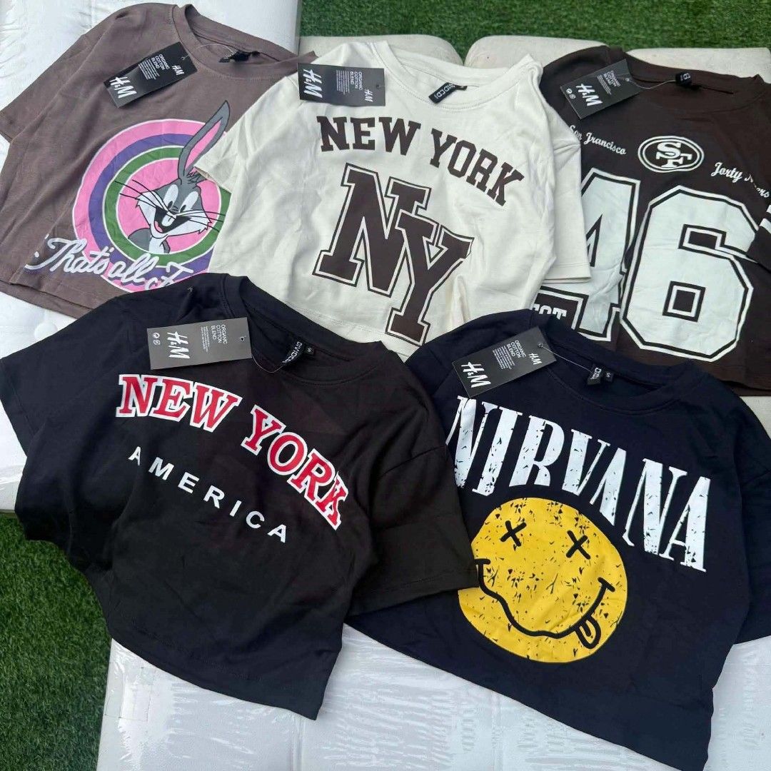 H&M Graphic T-Shirts - Various Designs (Category: Shirts) located in Quezon City. Submitted by sheyguzman (Listing ID 1464031928, Image 3). Description: Selling H&M graphic tees. Lots of designs like Nirvana, Ramones, Chicago Bulls, and New York themes. Short sleeve crop top. Great for casual wear. Grab a few for only 170 each Assorted size, design, and color for bundle..