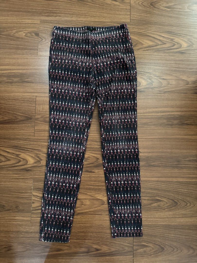 H&M Patterned Pants Size 8 (Category: Jeans) located in Rizal. Submitted by thrifty.mom (Listing ID 1463991378, Image 2). Description: - Stylish H&M pants with a unique geometric pattern. - Features a dark base with eye-catching red and white accents. - Convenient side zipper for easy wear. - Waist measures approximately 30 inches. - Ideal for a trendy casual look..