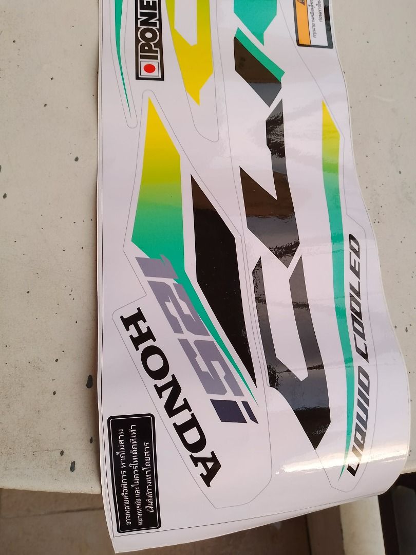 Honda Click 125i Liquid Cooled Decal Sticker Set (Category: Other Motorcycles Parts and Accessories) located in Rizal. Submitted by bargokarl (Listing ID 1464045400, Image 2). Description: Honda Click 125i Decals / Sticker Striping Set ₱200 **DESCRIPTION:** ✨ **Honda Click 125i Full Set Decal / Striping Sticker** ✨ 📌 **Price:** ₱200 lang (Super sulit!) 📌 **Condition:** Brand New / Hindi pa nagagamit (Kumpleto at buo pa ang sheet) 📌 **Design / 