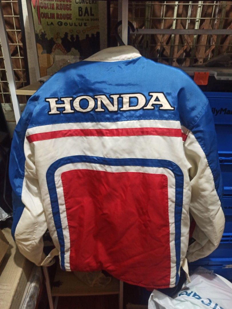 Honda Racing Vintage Jacket (Category: Coats, Jackets and Outerwear) located in Manila. Submitted by avrilarqu43176 (Listing ID 1463942946, Image 2). Description: - Vintage Honda racing jacket - Classic blue, red, and white colorway - Features iconic Honda wing logo on chest - 'HONDA' text on sleeves and back - Full zipper closure - Ideal for Honda enthusiasts and motorcycle riders.