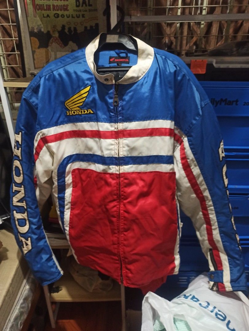 Honda Racing Vintage Jacket (Category: Coats, Jackets and Outerwear) located in Manila. Submitted by avrilarqu43176 (Listing ID 1463942946, Image 1). Description: - Vintage Honda racing jacket - Classic blue, red, and white colorway - Features iconic Honda wing logo on chest - 'HONDA' text on sleeves and back - Full zipper closure - Ideal for Honda enthusiasts and motorcycle riders.