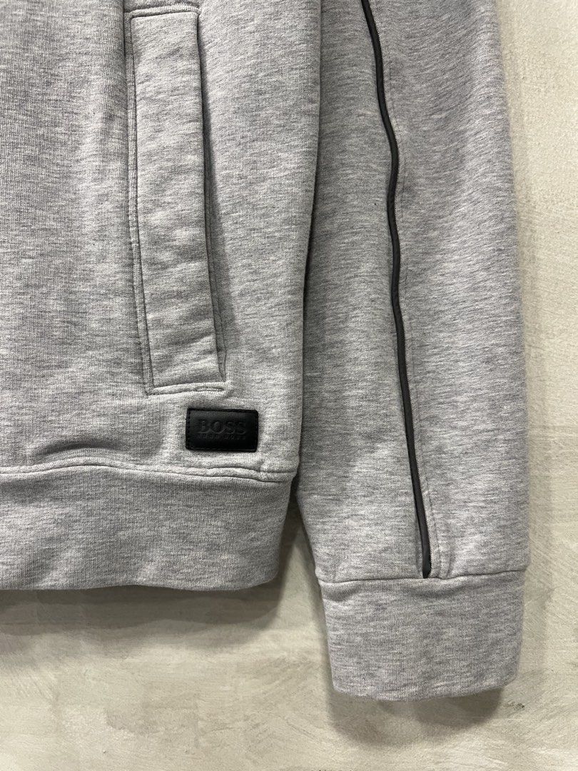 Hugo Boss Regular fit Zip jacket (Category: Coats, Jackets and Outerwear) located in Manila. Submitted by -handpick- (Listing ID 1463940813, Image 3). Description: This is a gray BOSS regular-fit stretch full-zip jacket featuring a contrasting dark fabric collar and piped shoulder details. Size : Large Dimensions : Length : 27 inches Width : 20 inches Shoulder : 18.5 inches Sleeve : 24.5 inches Issue : dot Stains Sign of wear in good condition .