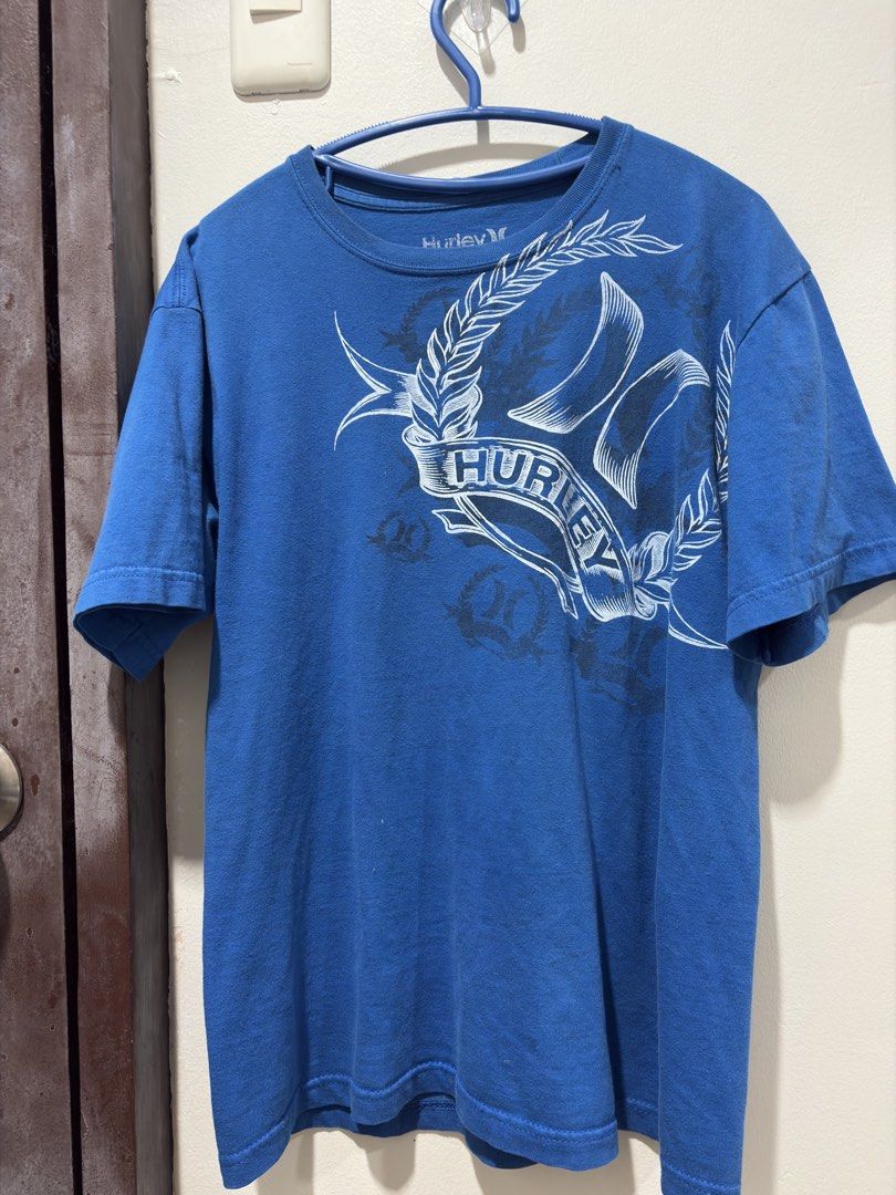 HURLEY TEE Y2K GRUNGE EMO SURF (Category: Tshirts & Polo Shirts ) located in Tacurong. Submitted by akth1en (Listing ID 1464081637, Image 1). Description: hurley blue shirt 21x26 w/l Issues:paint stain (not noticeable at all) M on tag.