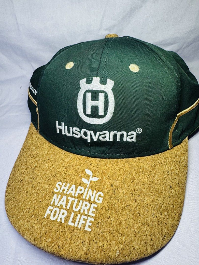 Husqvarna Limited Edition 2022 Cap (Category: Caps & Hats) located in Roxas City. Submitted by patsquarephantz (Listing ID 1463991390, Image 2). Description: - Limited Edition 2022 Husqvarna Cap - Stylish green and cork design - Features iconic Husqvarna logo - Includes 'Shaping Nature For Life' text - Accented with elegant gold trim - A must-have for any Husqvarna enthusiast.