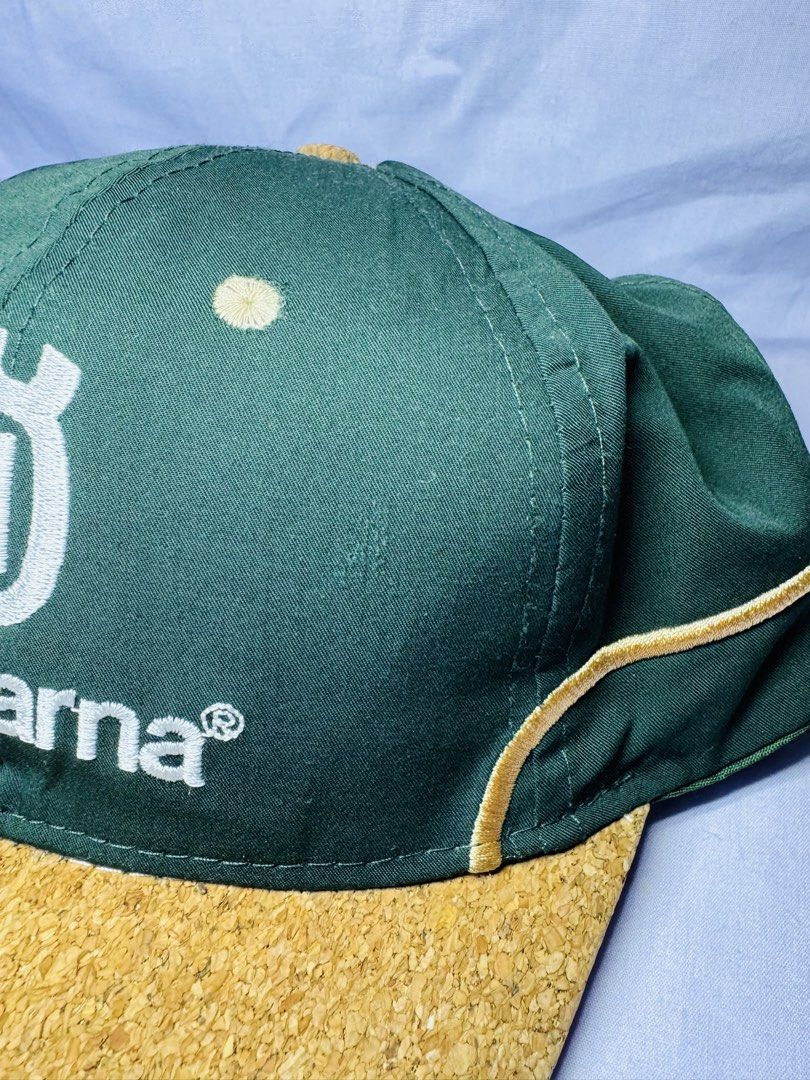 Husqvarna Limited Edition 2022 Cap (Category: Caps & Hats) located in Roxas City. Submitted by patsquarephantz (Listing ID 1463991390, Image 3). Description: - Limited Edition 2022 Husqvarna Cap - Stylish green and cork design - Features iconic Husqvarna logo - Includes 'Shaping Nature For Life' text - Accented with elegant gold trim - A must-have for any Husqvarna enthusiast.