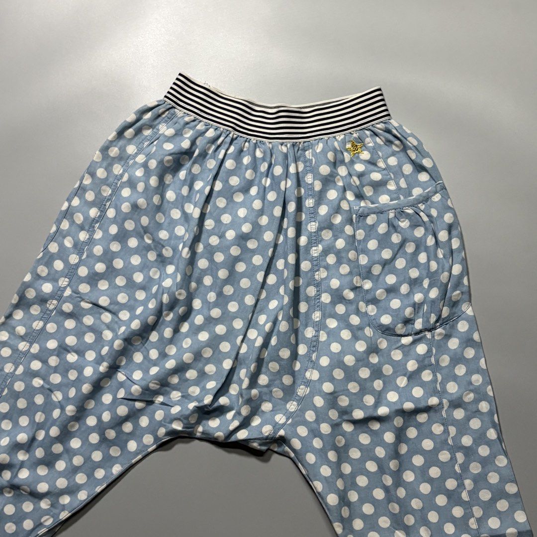 Hyoma 2000s Polka Dot Sarouel Harem Pants (Category: Other Bottoms) located in Tayabas. Submitted by tayabaskartell (Listing ID 1463964094, Image 2). Description: Hyoma 2000s Polka Dot Sarouel Harem Pants 2000s Hyoma drop-crotch sarouel pants with custom polka dots and embroidered star patch. Hyoma originated as the iconic mascot character created by Masahiro Nakagawa for his influential Japanese avant-garde label 20471120. Following the brand’s 
