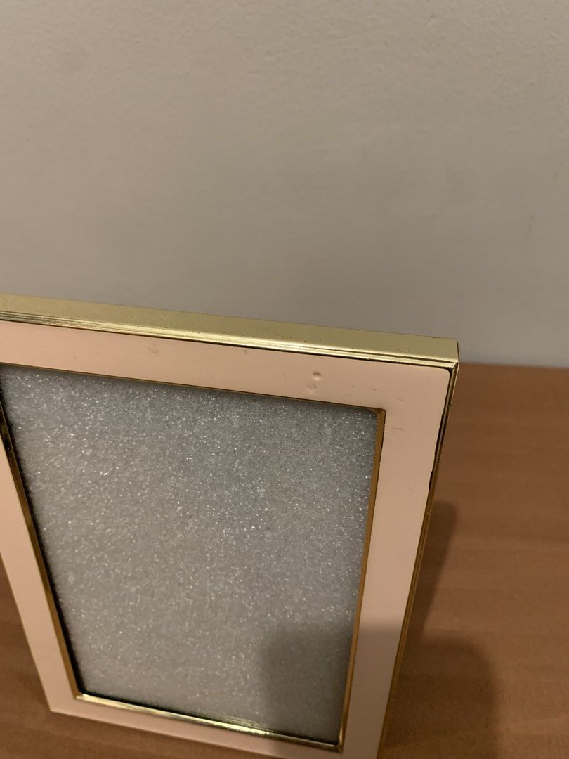 Isaac Jacobs Pink and Gold Picture Frame (Category: Frames & Pictures) located in Paranaque City. Submitted by zyyee (Listing ID 1463947470, Image 2). Description: - Cute pink and gold picture frame from Isaac Jacobs. - Fits 4x6 inch photos. - Versatile display: tabletop stand or wall hanging. - Small mark on top edge, as pictured. - Ideal for showcasing your cherished memories..