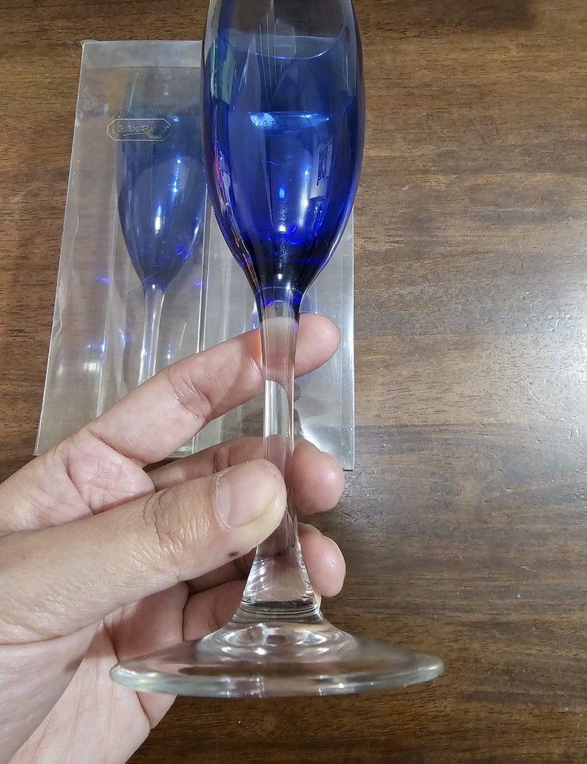 J.G. DURAND Champagne Flute - 2 pcs (Category: Dinnerware & Cutlery) located in Quezon City. Submitted by senyoramaria (Listing ID 1464000195, Image 2). Description: J.G. DURAND (Maker of Crystal d'Arques) Made in France Champagne Flute Cobalt blue and clear stem 2 inches rim diameter 7.75 inches tall Set of 2 Acetate box..