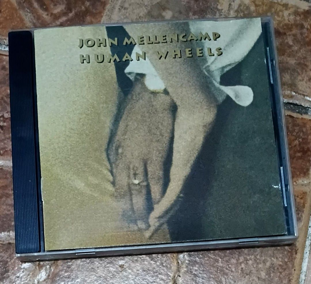 John Mellencamp Human Wheels CD (Category: CDs & DVDs) located in Quezon City. Submitted by dancatz (Listing ID 1464066233, Image 1). Description: □ P 200.00 - John Mellencamp's Human Wheels album on CD - Includes 10 tracks - Notable songs: 'When Jesus Left Birmingham', 'To The River' - Produced by John Mellencamp, Malcolm Burn, David Leonard, and Michael Wanchic - Made in Canada - A great addition to any music collection LFB Seller's location : 