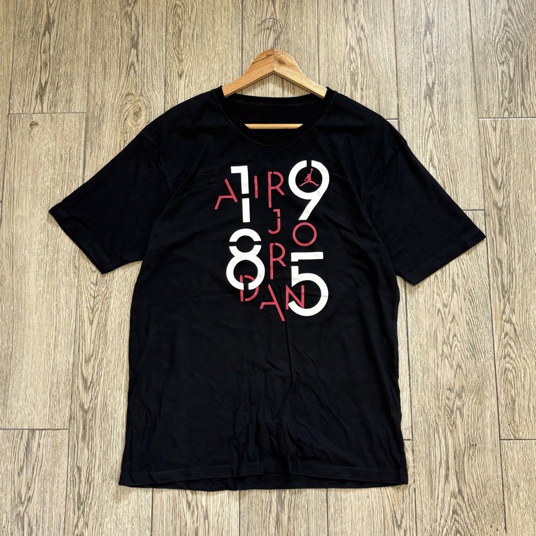 Jordan Black Graphic T-Shirt (Category: Tshirts & Polo Shirts ) located in Imus. Submitted by reloved.nd (Listing ID 1464072712, Image 1). Description: - Black t-shirt with a cool graphic print - Features 'AIR JORDAN 1985' in white and red - Made from comfortable cotton material - Ideal for casual wear - Perfect for any Michael Jordan fan.