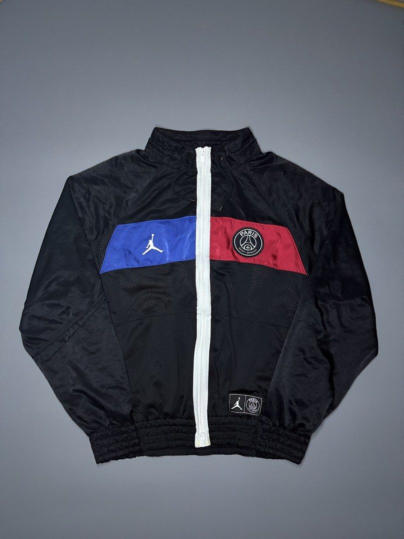 Jordan Paris Saint-Germain Track Jacket (Category: Coats, Jackets and Outerwear) located in Manila. Submitted by adroitamar51133 (Listing ID 1464029549, Image 2). Description: - Authentic Jordan x PSG track jacket - Features iconic Jumpman and Paris Saint-Germain logos - Bold blue and red color blocking on the front - 'PARIS' lettering with Jumpman logo on the back - Vibrant geometric pattern lining - Full zip closure - Elasticated cuffs and hem.