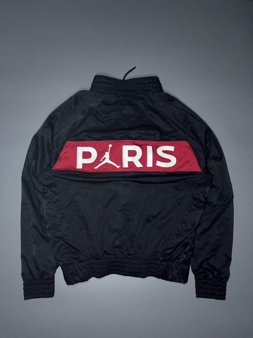 Jordan Paris Saint-Germain Track Jacket (Category: Coats, Jackets and Outerwear) located in Manila. Submitted by adroitamar51133 (Listing ID 1464029549, Image 3). Description: - Authentic Jordan x PSG track jacket - Features iconic Jumpman and Paris Saint-Germain logos - Bold blue and red color blocking on the front - 'PARIS' lettering with Jumpman logo on the back - Vibrant geometric pattern lining - Full zip closure - Elasticated cuffs and hem.