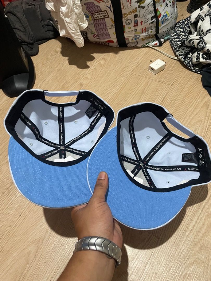 Jordan Snapback Caps (2 pcs) (Category: Caps & Hats) located in Sorsogon. Submitted by solayram0114595 (Listing ID 1464085315, Image 3). Description: - Set of 2 Jordan snapback caps - Color: Light blue with white Jumpman logo - Size: One size fits all (adjustable strap at the back) - Condition: Brand new with tags attached - Ideal for: Casual wear, sports, or completing your streetwear look.
