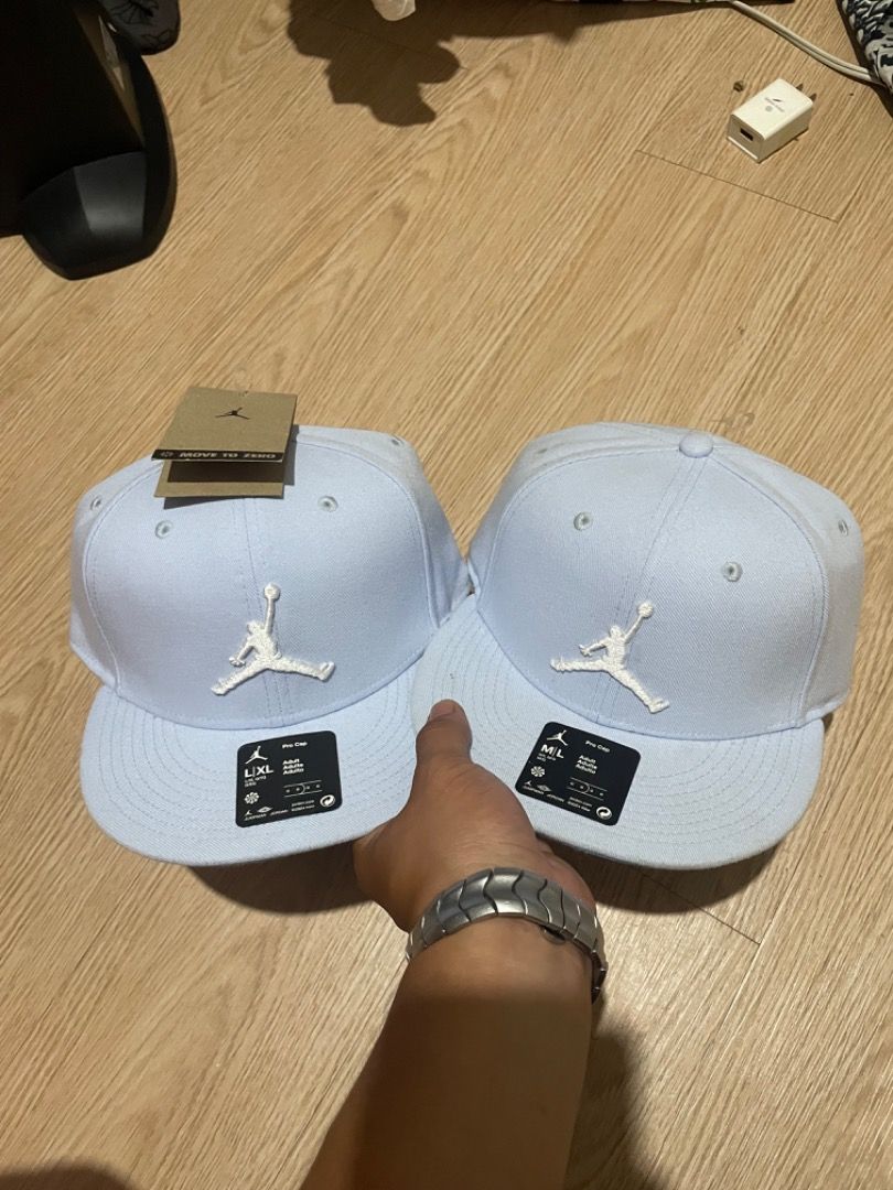 Jordan Snapback Caps (2 pcs) (Category: Caps & Hats) located in Sorsogon. Submitted by solayram0114595 (Listing ID 1464085315, Image 1). Description: - Set of 2 Jordan snapback caps - Color: Light blue with white Jumpman logo - Size: One size fits all (adjustable strap at the back) - Condition: Brand new with tags attached - Ideal for: Casual wear, sports, or completing your streetwear look.
