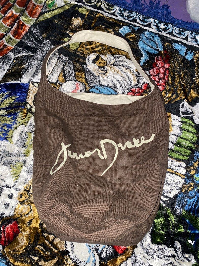 Junior Drake Brown Canvas Tote Bag (Category: Tote Bags) located in Manila. Submitted by reginemarquez412 (Listing ID 1464058813, Image 1). Description: - Brand: Junior Drake - Material: Brown canvas - Interior: Cream with brown trim - Design: Simple and spacious - Use: Great for everyday carry.