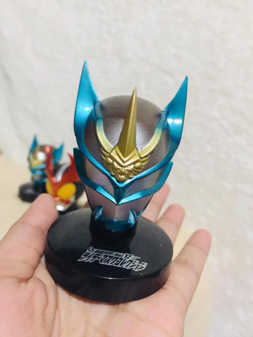 Kamen Rider Helmet Mini Figures Set (Category: Figurines & Statues) located in Baguio. Submitted by izza_thrifty (Listing ID 1464082047, Image 2). Description: - Set of 3 Kamen Rider helmet mini figures - Includes the main Rider and two other characters - Each figure comes with a display base - Bases feature Japanese text - One base has a battery compartment (functionality not specified) - Ideal for Kamen Rider collectors.