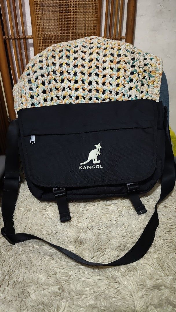 Kangol Black Messenger Bag (Category: Sling Bags) located in Cebu City. Submitted by lumaynojes00490 (Listing ID 1463958930, Image 3). Description: - Brand: Kangol - Color: Black - Iconic kangaroo logo on the front - Multiple interior compartments for organization - Adjustable strap for comfortable carrying - Ideal for daily use and travel.