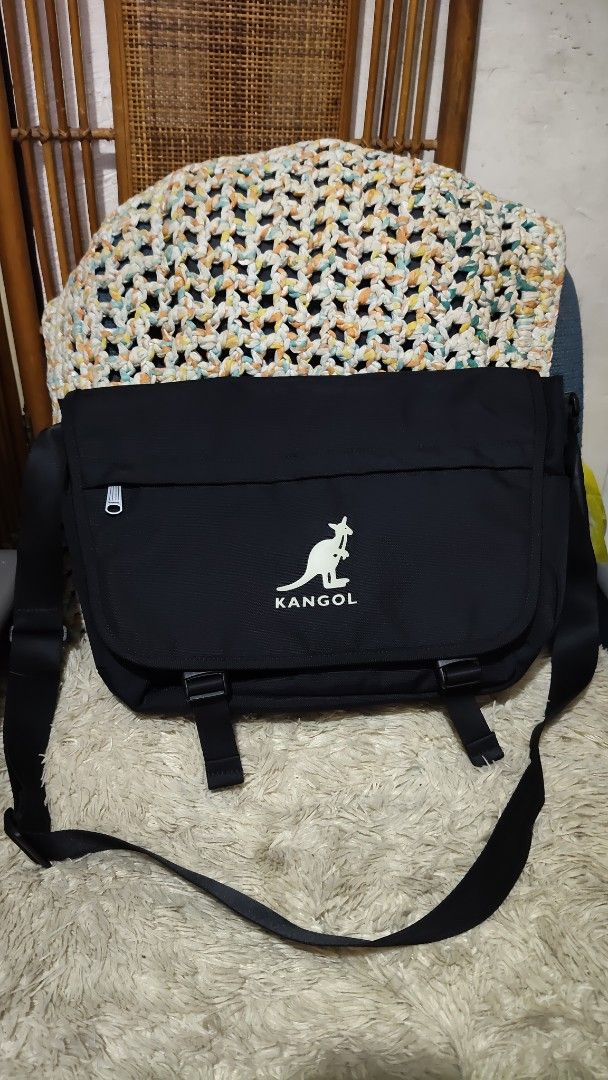 Kangol Black Messenger Bag (Category: Sling Bags) located in Cebu City. Submitted by lumaynojes00490 (Listing ID 1463958930, Image 2). Description: - Brand: Kangol - Color: Black - Iconic kangaroo logo on the front - Multiple interior compartments for organization - Adjustable strap for comfortable carrying - Ideal for daily use and travel.
