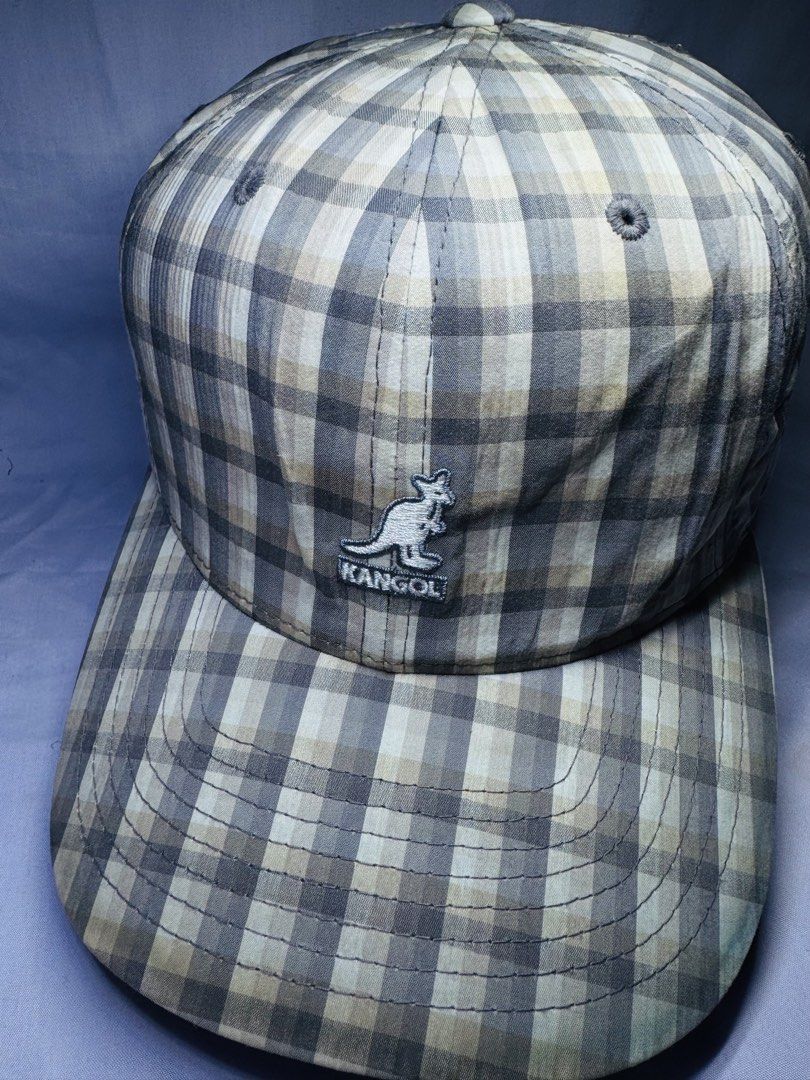 Kangol Plaid Baseball Cap (Category: Caps & Hats) located in Roxas City. Submitted by patsquarephantz (Listing ID 1463992663, Image 2). Description: - Classic Kangol cap - Stylish plaid pattern - Iconic embroidered kangaroo logo - Adjustable strap for a perfect fit - Versatile for casual wear - Complements various outfits.