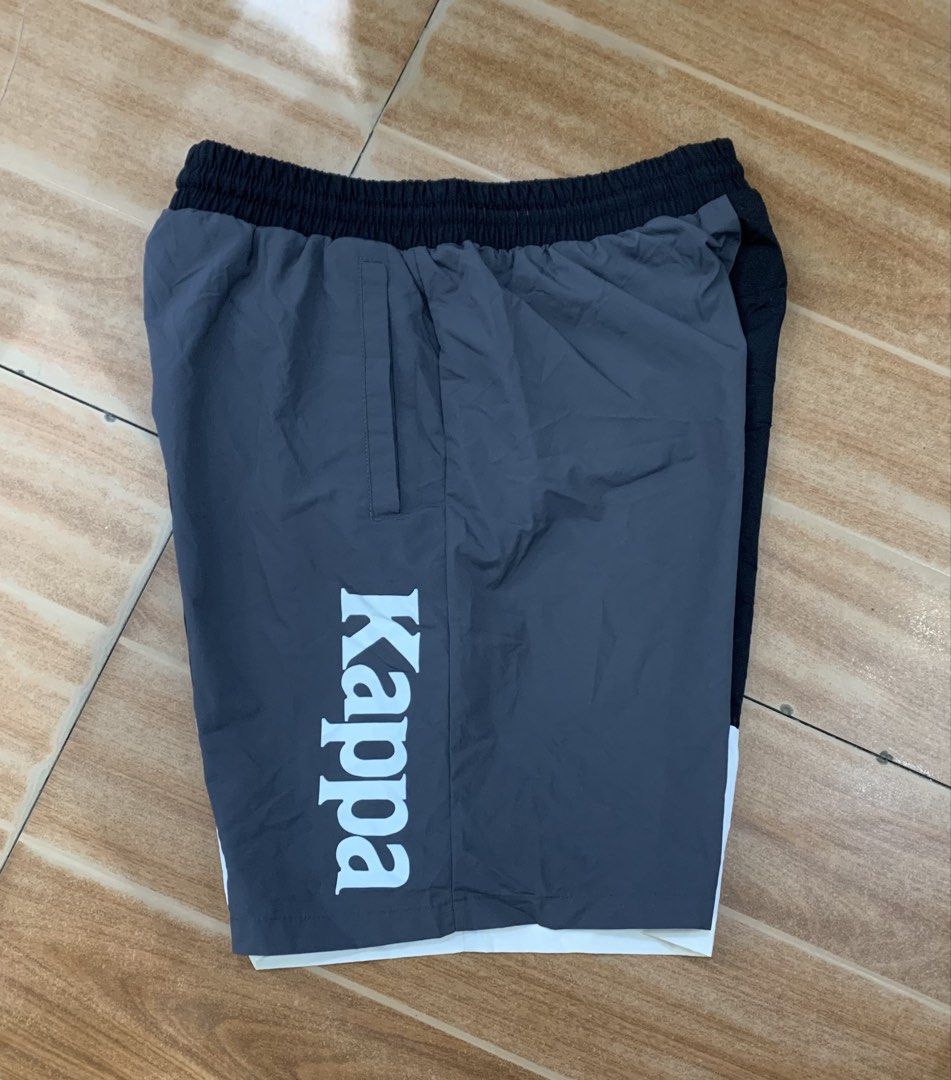 Kappa Colorblock Shorts Medium (Category: Shorts) located in Cebu City. Submitted by jkeive (Listing ID 1463964391, Image 2). Description: - Stylish Kappa colorblock shorts in black, grey, and white. - Size Medium(39-34x18) - Features the iconic Kappa logo on the front and side. - Comfortable elastic waistband with adjustable drawstring. - Versatile for both athletic activities and everyday casual wear..