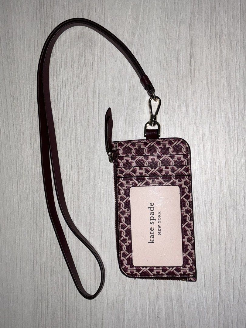 Kate Spade Card Case Lanyard Pink Multi (Category: Wallets & Card holders) located in San Juan City. Submitted by herdaintyfinds (Listing ID 1463962280, Image 1). Description: - Kate Spade card case with lanyard - Signature interlocking monogram print in pink multi - Zippered compartment for coins or cards - Clear window for ID - Detachable lanyard included - Perfect for keeping essentials handy.