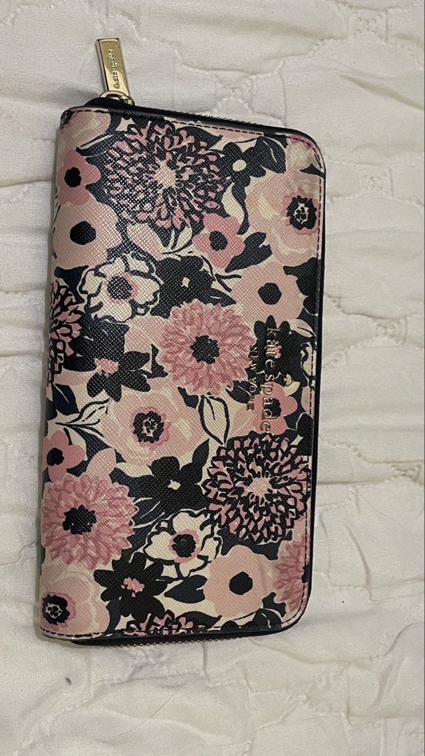 Kate Spade Floral Zip Around Wallet (Category: Wallets & Card holders) located in Manila. Submitted by heyuzlh (Listing ID 1464104137, Image 1). Description: - Cute Kate Spade wallet - Pink and black floral print - Zip around closure - Multiple interior card slots - Zippered coin pocket - Ample space for essentials - Gold tone hardware -minimal yellow stain (as shown in the pics) .